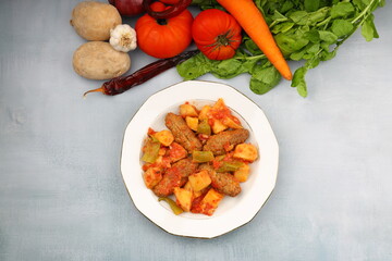 Traditional Homemade Turkish Food Kofte - Kofta with Tomato Sauce and Potatoes. (Turkish name; Izmir kofte)