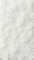Close up of a soft, fluffy white texture, ideal for backgrounds in design projects, packaging, or food related themes.