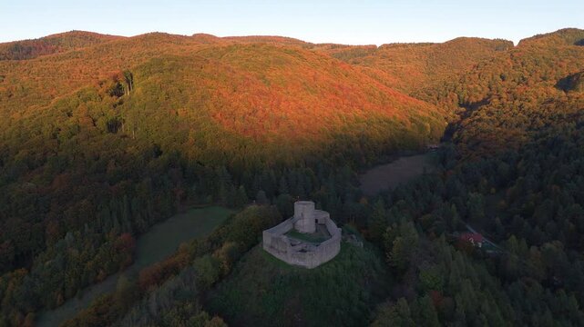 ruins of rytro castle in polish mountains at sunset in autumn