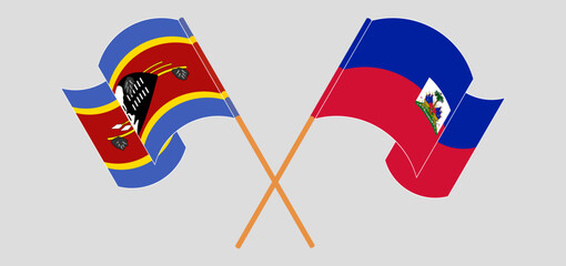Crossed and waving flags of Eswatini and Republic of Haiti. Vector illustration