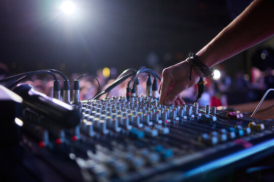 This is a professional audio mixing console that features colorful faders for enhanced usability