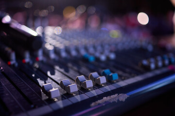 This is a professional audio mixing console that features colorful faders for enhanced usability