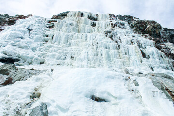 Lo Barnechea, Metropolitan Region, Chile - October 20, 2024: Frozen Sulfatos waterfalls, Yerba Loca...