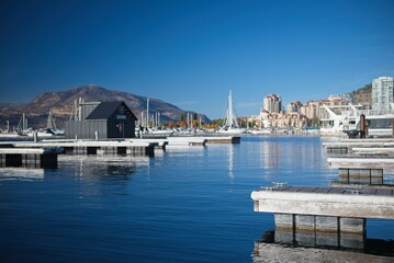 Obraz premium Serene Marina with Docks and Sailboats
