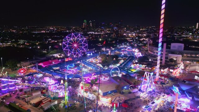 Panning Aerial of Texas State Fair and Dallas Skyline at Night