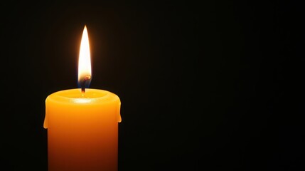 burning candle isolated on black background
