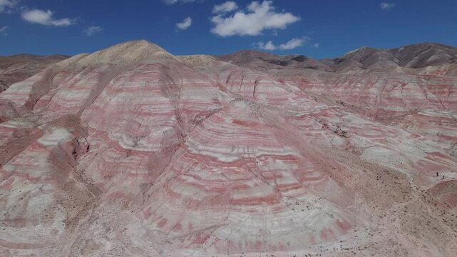 Stunning aerial drone footage of the unique Candy Cane Mountains, red and white striped formations near the Guba to Baku highway in Khizi District, Azerbaijan, Central Asia, Asia