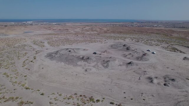 Stunning aerial drone footage of geological formations near Gobustan, part of one of the world's largest concentrations of mud volcanoes, Azerbaijan, Central Asia, Asia