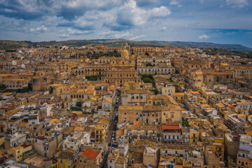 Cityscape of Noto with the cathedral of St. Nicholas of Myra San Nicolo , small town near Syracuse Siracusa , Sicily island, Italy, Europe. Aerial panoramoc picture. June 2023