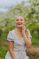 Fototapeta premium Portrait on a stool in a spring orchard 5