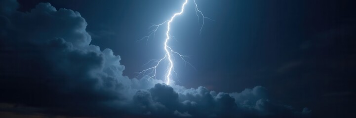 A dramatic lightning strike illuminates dark clouds, capturing nature's power and intensity, perfect for weather related projects or dramatic visual content.