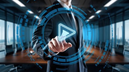 A man in a suit is pointing at a blue and white screen with a red triangle