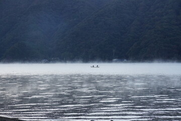 boat on the misty lake