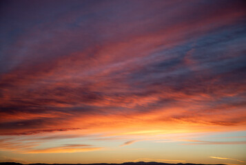 Fototapeta premium Dramatic red sunset in Wyoming orange blues