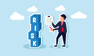 Fototapeta premium A businessman is carrying a pencil and a clipboard with a checklist, recording a pile of boxes labeled RISK, illustrating the documentation for business calculations to minimize risk