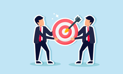 Two businessmen are collaborating to carry a target board, illustrating teamwork and collaboration between companies in a joint business project agreement