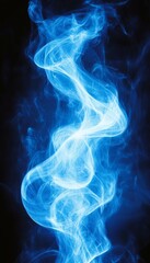 Obraz premium Abstract blue smoke swirls against a dark background.