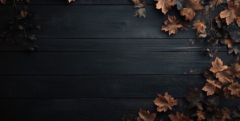 A dark wooden surface adorned with autumn leaves, evoking a seasonal atmosphere.