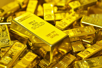 Big and height value gold bar surround  with many small gold bars.Gold is hard commodity goods, risk asset, tangible value that used to be gold reserve, save assets during war and economic crisis