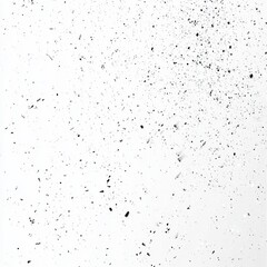 Abstract white background with black specks and dust particles.