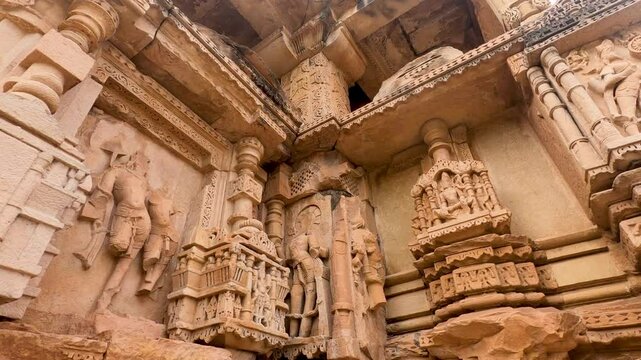 Closup of Indian Ancient Hindu Temple Sculptures on wall, a historic temple made with stone carving and art sculptures in India. At Sas-Bahu Twin Temples, are the11th-century twin temples in Gwalior, 