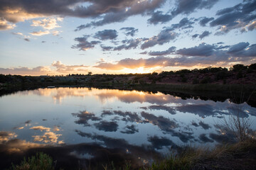 Striking post sunset ove a lake in a Utah summer with clouds, relaxing scene 
