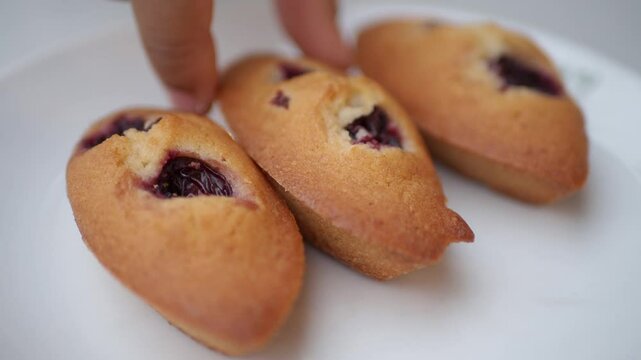 Deliciously Freshly Baked Madeleines with a Tasty Fruit Filling Inside for Enjoyment