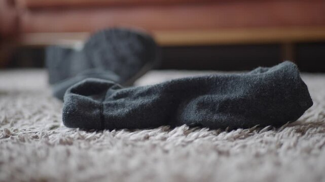 dirty sock and shoe on floor 