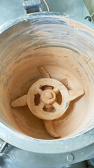 Production of compact powder in a cosmetic factory machine mixing compact powder