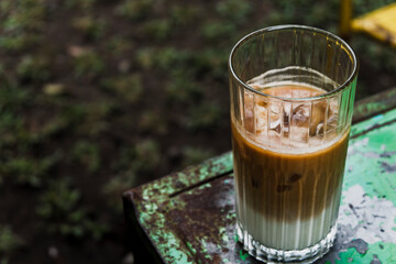 an iced coffee sitting on top of a table