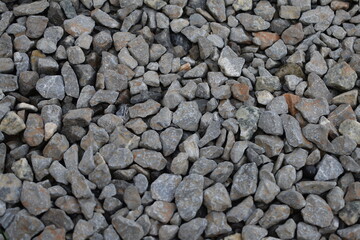 High-resolution close-up of small gray gravel stones, ideal for backgrounds, 3D modeling, and digital art. Showcases detailed, natural stone texture.