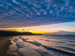 Winter seascape views over the beach with high and medium cloud cover