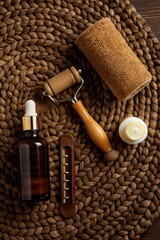 Spa essentials arranged on a woven mat.