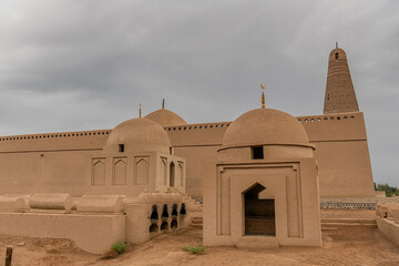 The Emin minaret and Uyghur mosque visible from behind the tombs in Turpan