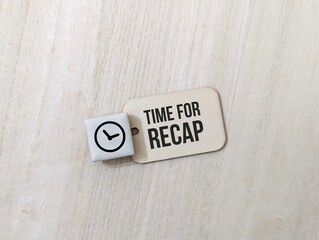 a white tag with the clock icon and the words Time For Recap. business finance ,education