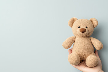 Obraz premium A cozy companion embracing the comfort of a plush bear in your hands