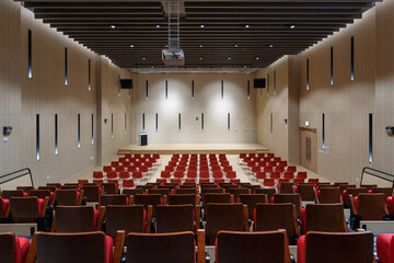 Auditorium interior with neat rows of empty seats