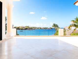 Fototapeta premium Stunning coastal view from a sunny balcony overlooking the serene blue waters of the bay