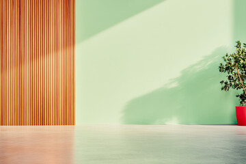 Fototapeta premium A contemporary interior showcasing green walls, wooden panels, a potted plant, and natural light
