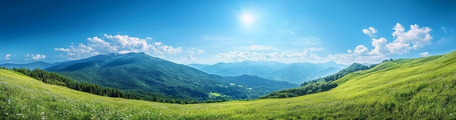 Fototapeta premium Panoramic view of green grassy hills under a blue sky with white clouds and a bright sun.