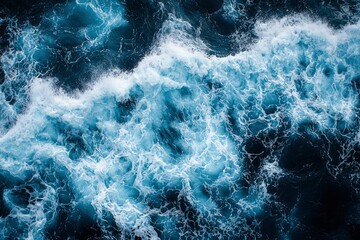 An Aerial View of the Ocean's Surface with Waves and Foam