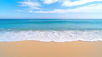 Fototapeta premium A tranquil beach scene with crystal clear waters, gentle waves, and a bright blue sky, perfect for relaxation and enjoying nature.