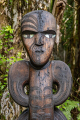 Maori Carving on the Kauri Cascades trail in the Waitakere Ranges, New Zealand. 6 October 2024