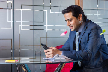 Businessman text messaging using digital tablet