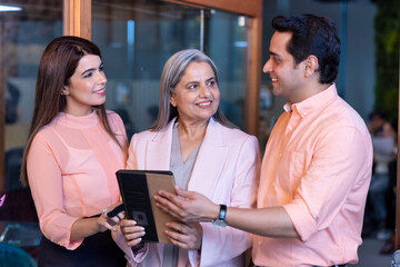 Business people working on digital tablet in the office