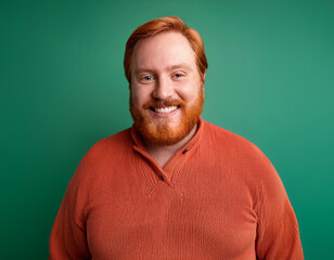 Obraz premium Studio Portrait of Handsome Mature Man Happily Smiling Against Green Background