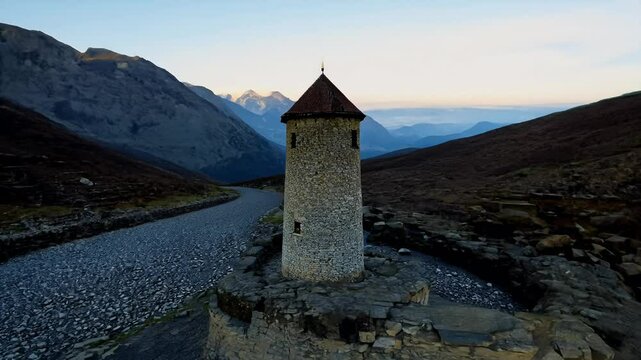 toric ruins old Tusheti tower located foothills Caucasus Mountains Georgia nearly dried mountain stream visible background beautifully captured 4K caucasia ruin sunset global warming tour