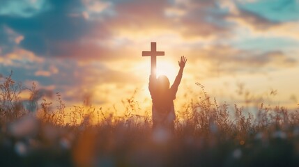 Worship God concept: Silhouette christian people hand rising over blurred cross on spiritual light background