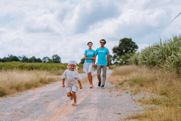 family volunteer couple walking in the park