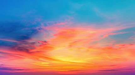 Obraz premium Vibrant sunset over calm clouds creating a serene and colorful sky